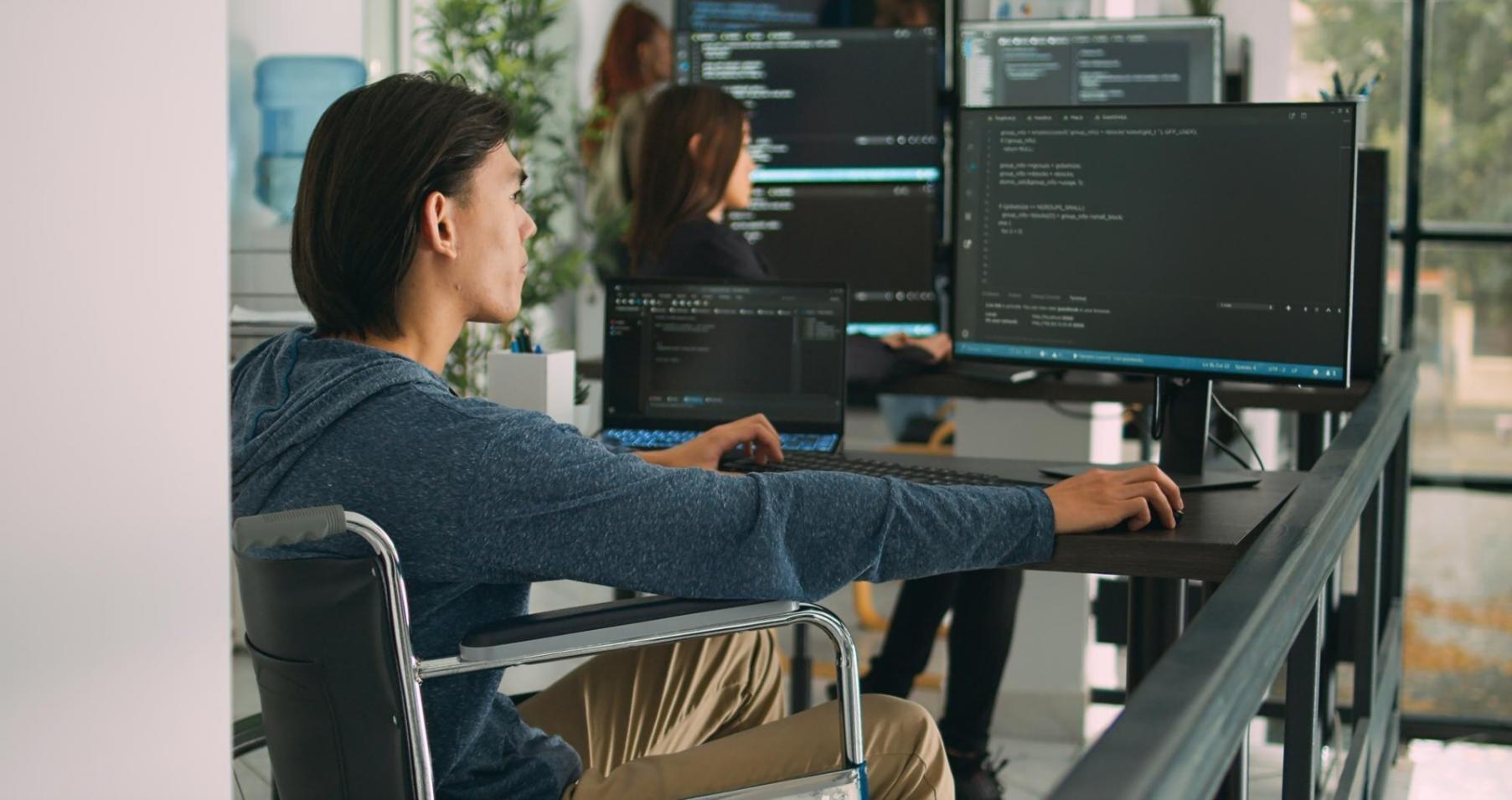 Students working on authentication code in a modern classroom setting